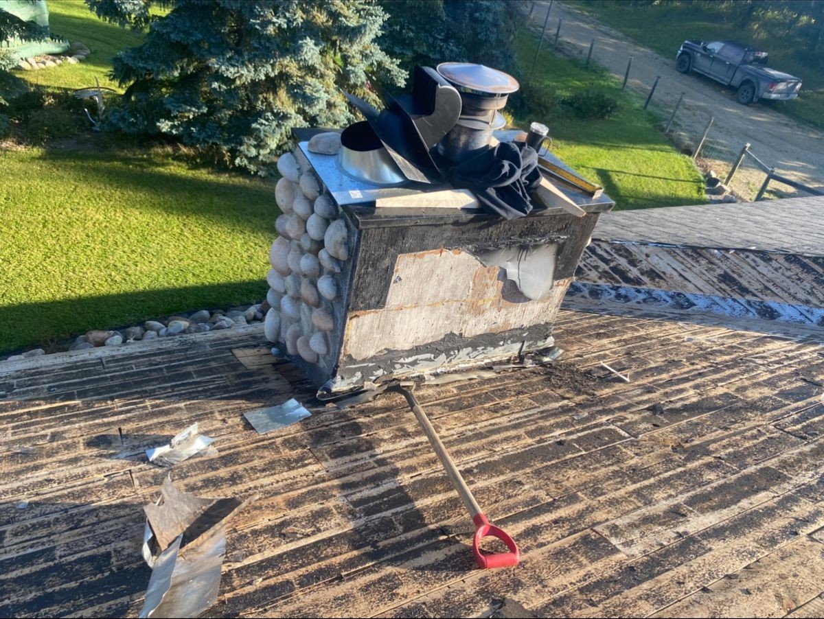 Kayan Contracting crew installing new roofing shingles on a Parkland County home
